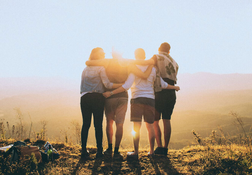 friends standing at the top of a hike in California in rehab