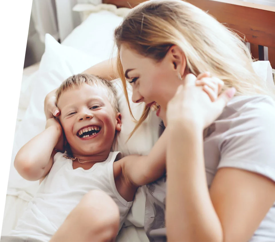 woman smiling with son after addiction recovery